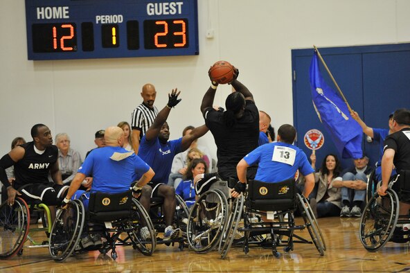 Members of the Air Force wheelchair basketball team compete May 18, 2011, at the 2011 Warrior Games in Colorado Springs, Colo. One of the highlights of the new Veterans Affairs paralympic program website is the "Success Stories" page, which features disabled veterans and their stories of how participating in adaptive sports has positively impacted their lives.  (U.S. Air Force photo/Staff Sgt. Desiree N. Palacios)