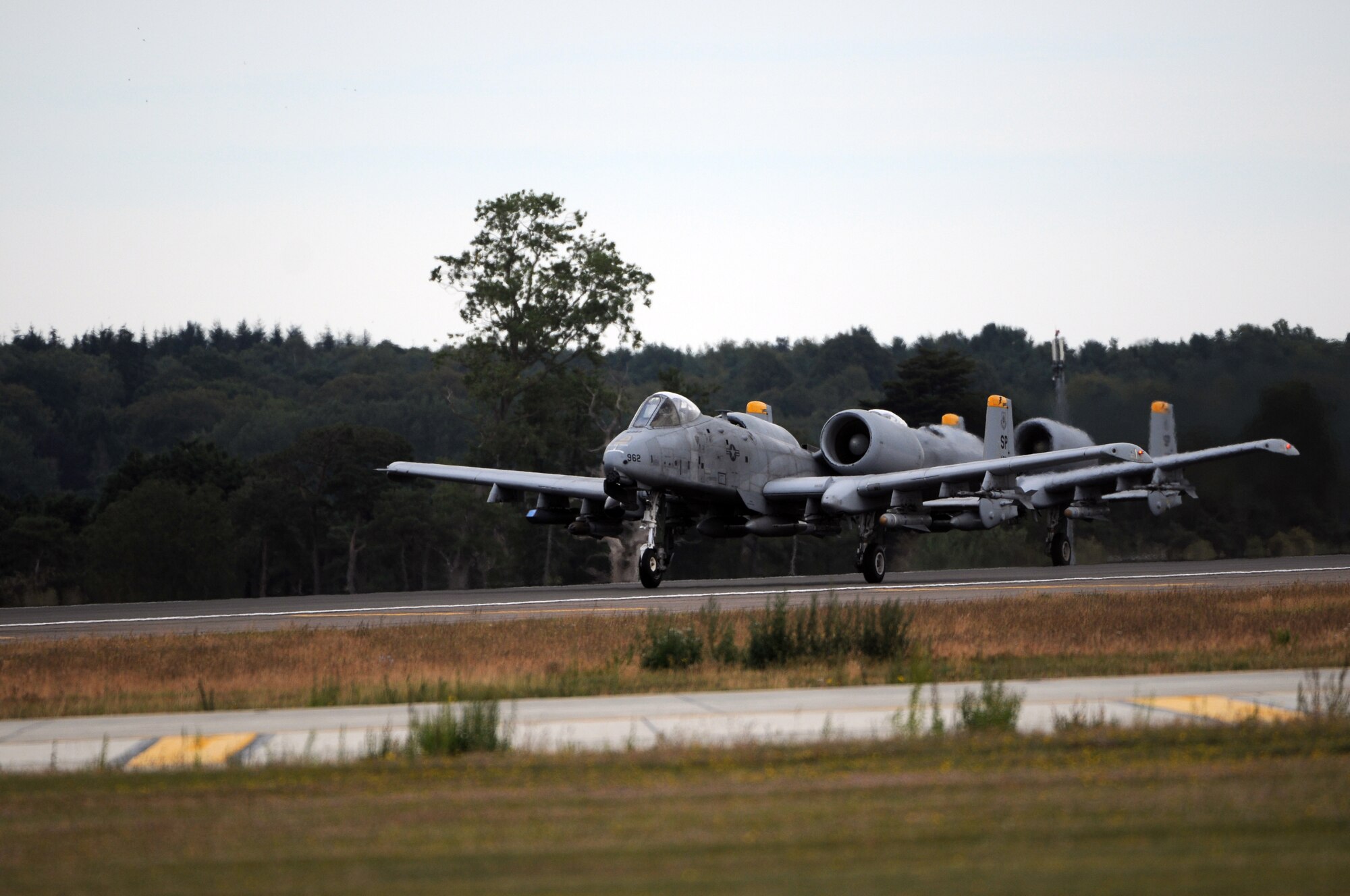 ROYAL AIR FORCE LAKENHEATH, England -- Two A-10 Thunderbolt II from the 81st Fighter Squadron, Spangdahlem Air Base, Germany, prepare to take off from RAF Lakenheath, Aug. 17, 2011. The A-10s were at Lakenheath in support of a U.K.-led exercise. The A-10 is a highly accurate weapons-delivery platform and has excellent maneuverability at low air speeds and altitude. (U.S. Air Force photo/Airman Cory D. Payne)