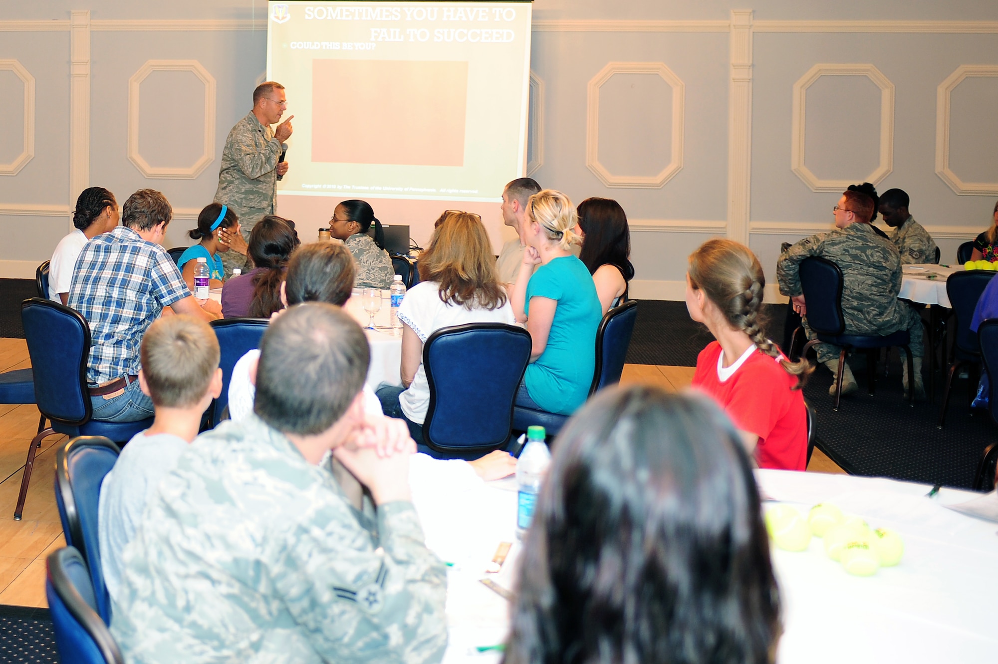 SEYMOUR JOHNSON AIR FORCE BASE, N.C. – Lt. Col. Greg Laffitte speaks to members of the resiliency training seminar here Aug. 12, 2011. The training helped Airmen and their families adapt to military life. The analogy used throughout the seminar was to bouncing back from difficult challenges, like a tennis ball, instead of breaking, like an egg. Laffitte is a resiliency trainer from Moody Air Force Base, Ga. (U.S. Air Force photo by Senior Airman Rae Perry/ Released)