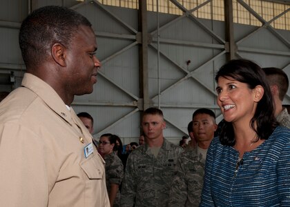 South Carolina Governor Nikki Haley speaks with Cmdr. Mark Glover after the ceremonial bill signing at Joint Base Charleston Aug.17. The bill makes it easier for South Carolinians abroad to participate in federal, state and local elections. Glover is the Space and Naval Warfare Systems Command  Systems Center Atlantic commander. (U.S. Air Force photo/Staff Sgt. Katie Gieratz)