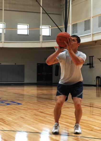 Airman 1st Class Richard Rapka, 7th Aircraft Maintenance Squadron, plays basketball Aug. 16, 2011 in the recently renovated gymnasium at Dyess Air Force Base, Texas. The gym floor renovation cost $150,000 and is one of many renovations completed at the fitness center. (U.S. Air Force photo by Airman 1st Class Jonathan Stefanko/ Released)