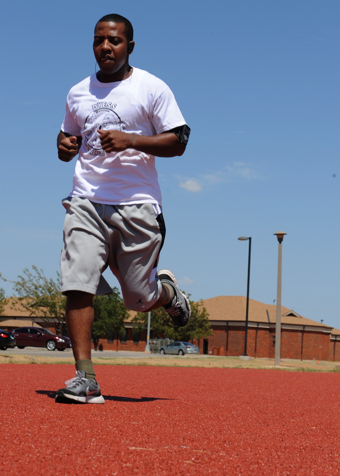 Senior Airman Jeffery Sullivan, 7th Maintenance Operations Squadron, runs on an improved mile-long track Aug. 16, 2011 at Dyess Air Force Base, Texas. The mile-long track renovation cost $500,000 and is one of many renovations completed at the fitness center. (U.S. Air Force photo by Airman 1st Class Jonathan Stefanko/ Released)
