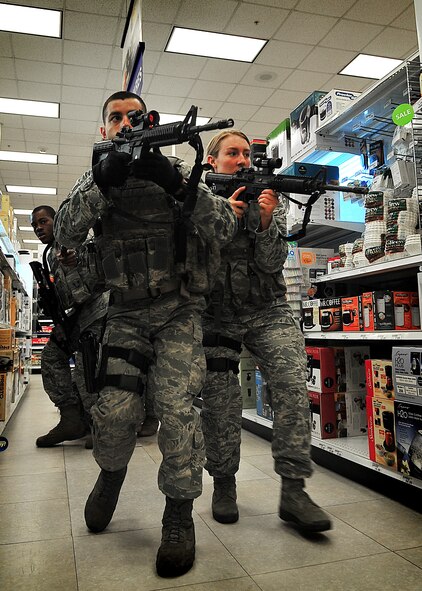 Airmen from the 51st Security Forces Squadron respond to a simulated active shooter and hostage scenario at Osan Air Base, South Korea, Aug. 11, 2011. The simulation is part of a qualification course for the base’s quick-response team. (U.S. Air Force photo/Staff Sgt. Daylena Gonzalez)