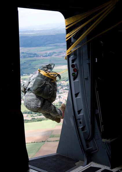 In support of International Jump Week 2011, U.S. military members, along with soldiers from six other NATO nations, parachute from a C-17 Globemaster III over Marnheim, Germany, Aug. 10, 2011. International Jump week included more than 200 military jumpers from the U.S., Germany, United Kingdom, Italy, Denmark and Netherlands. The NATO countries participated in the jump in an effort to learn from their coalition partners and strengthen working relationships. (U.S. Air Force photo/Master Sgt. Wayne Clark)