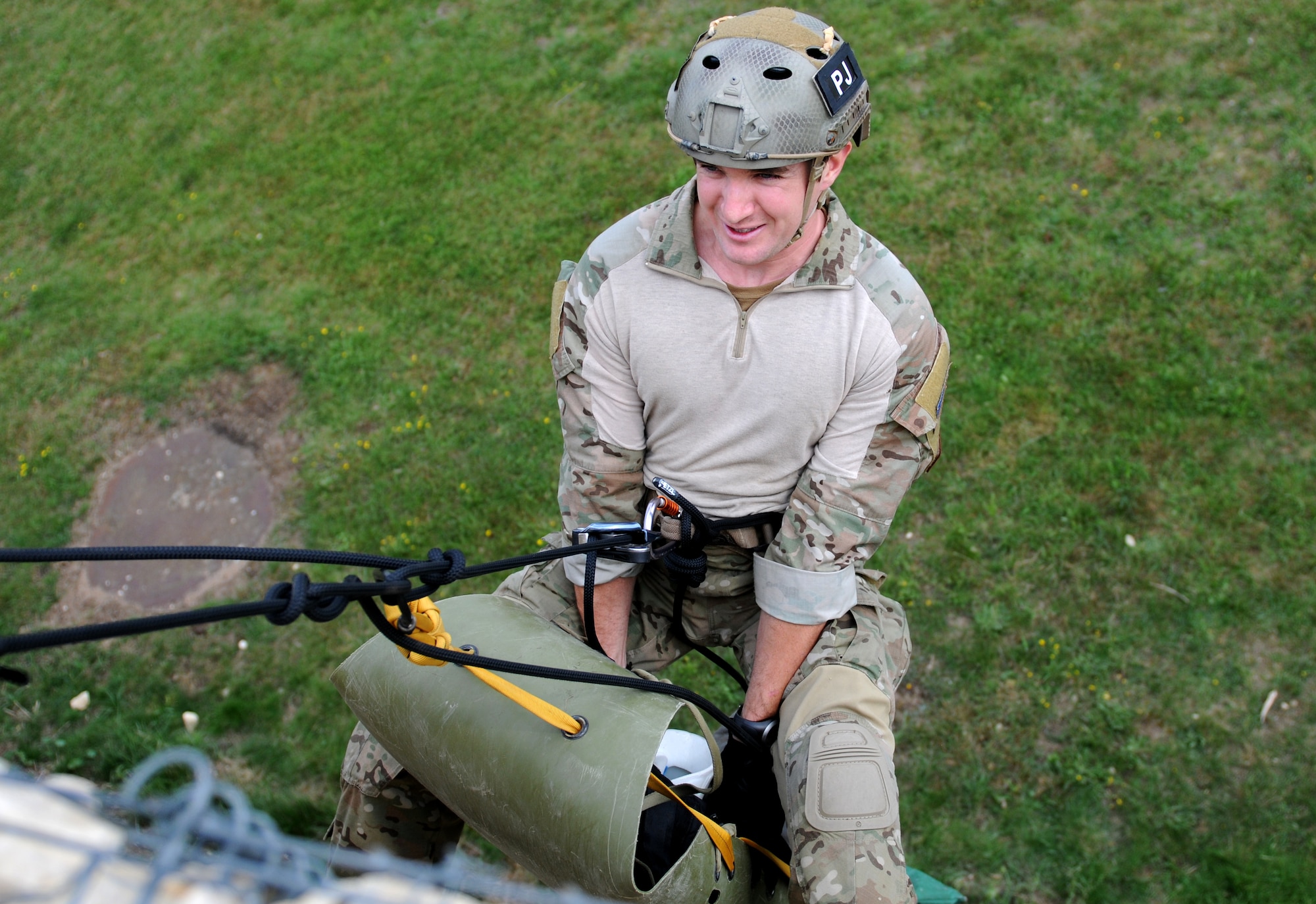 ROYAL AIR FORCE LAKENHEATH, England - Staff Sgt. Joshua Kruse, 56th Rescue Squadron pararescue journeyman, raises a mock patient during a training exercise on August 15, 2011. Kruse was nominated for a Liberty Spotlight because he displays the core value of "Service Before Self". (U.S. Air Force photo/Airman Cory Payne) 
