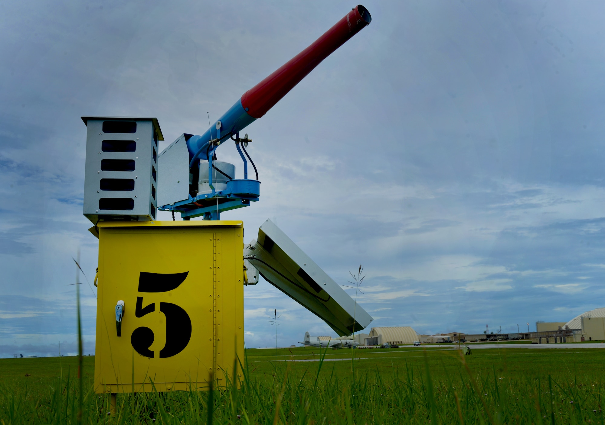 A sound-producing cannon waits to be activated just off the main taxiway here Aug. 18. The system of 30 non-lethal, sound-producing cannons is designed to scare birds away from Andersen’s runways in an effort to minimize loss of Air Force resources and personnel from hazardous wildlife populations on Andersen’s runway. (U.S. Air Force photo by Senior Airman Benjamin Wiseman/Released)