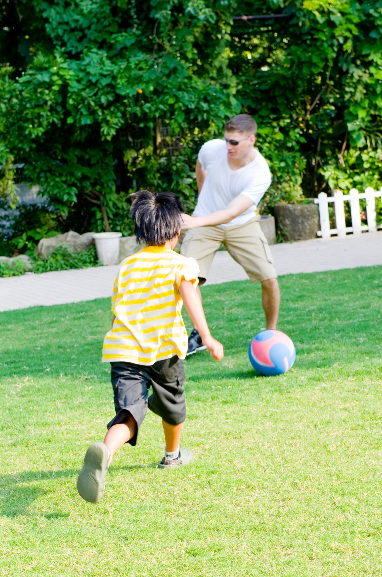 TACHIKAWA, Japan -- A child from the Shisei Gakusha children's home retrieves a ball during a kickball game at Tachikawa, Japan, Aug. 16, 2011. 374th SFS Airmen from Yokota Air Base, Japan, donated toys, clothing and food for the children, in an act of good will towards their off-base neighbors. (U.S. Air Force photo/Airman 1st Class Krystal M. Garrett)