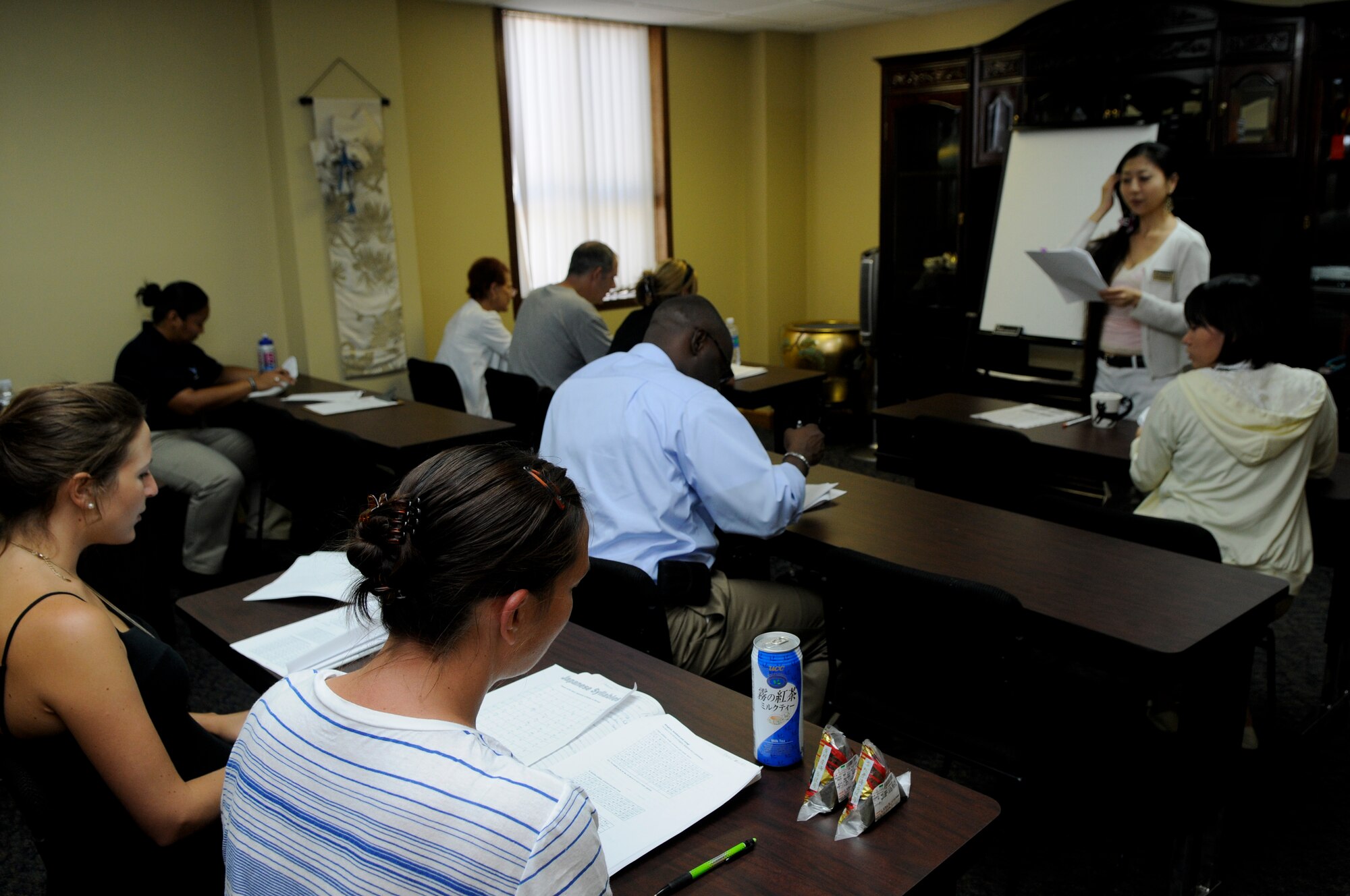 People attending the “Japanese for Busy People” class at the Airman and Family Readiness Center on Kadena Air Base, Japan, repeat Japanese words and phrases with the instructor, Aug. 17. Despite Kadena going through an Operational Readiness Inspection, the A&FRC is still performing as many services as possible to those stationed on the island. (U.S. Air Force photo/Airman 1st Class Maeson L. Elleman)