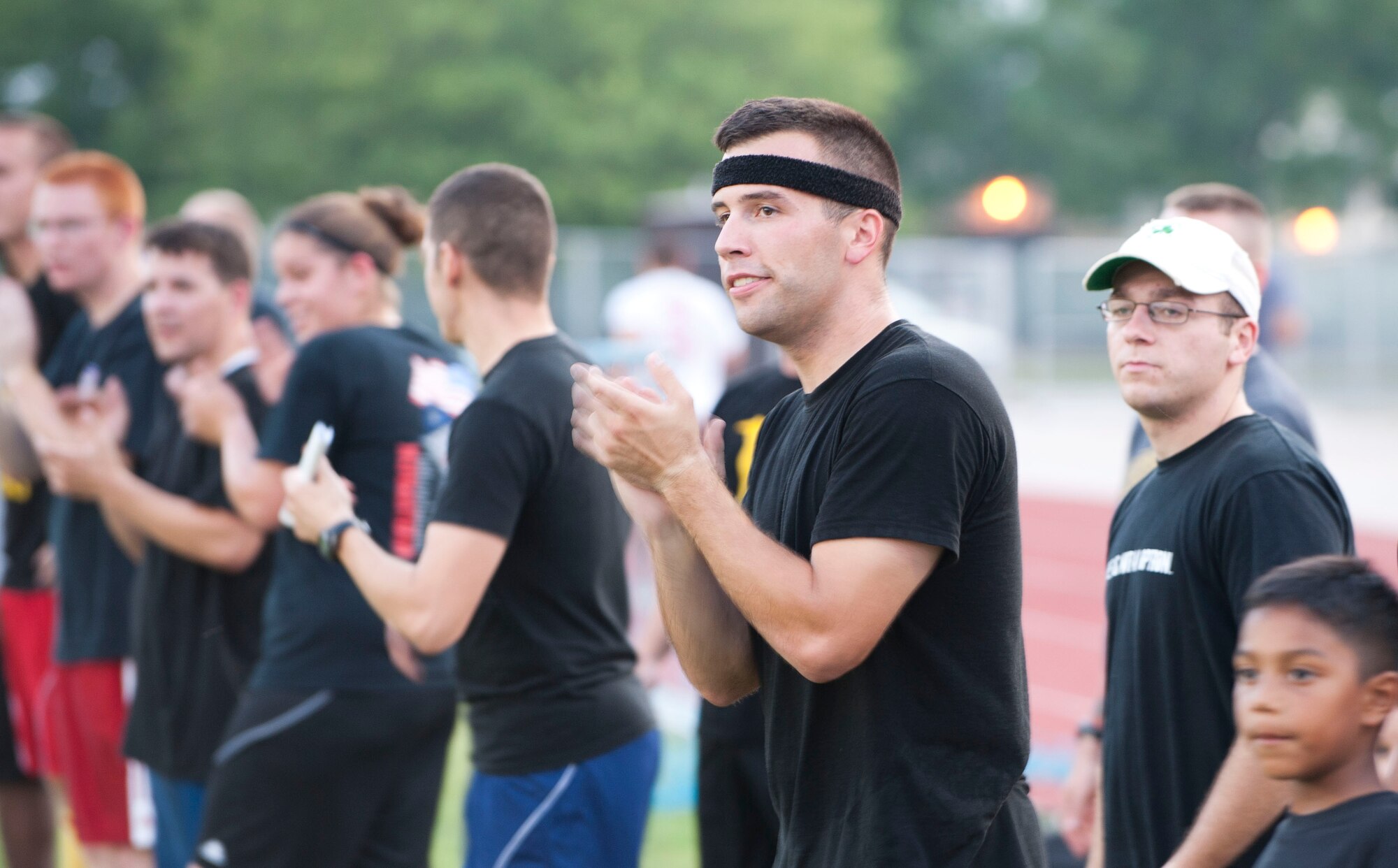 Players and fans of the 39th Maintenance Squadron cheer for their team during one of the first intramural soccer games of the season Aug. 16, 2011, at Incirlik Air Base, Turkey. The 39th MXS won the game 1-0. The regular season is scheduled to run through late September. (U.S. Air Force photo by Airman 1st Class Clayton Lenhardt/Released)