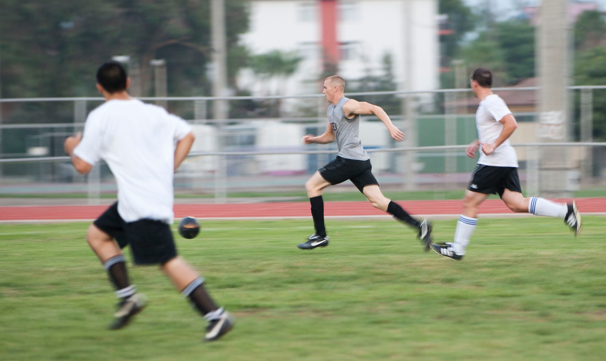 Players from the 39th Communications Squadron take a shot at the goal during one of the first intramural soccer games of the season Aug. 16, 2011, at Incirlik Air Base, Turkey. The 39th Maintenance Squadron won the game 1-0. The regular season is scheduled to run through late September. (U.S. Air Force photo by Airman 1st Class Clayton Lenhardt/Released)