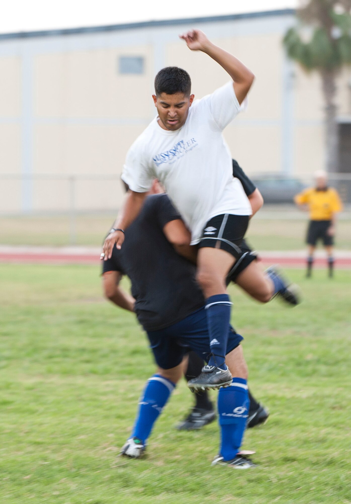 Andres Picado, 39th Communications Squadron, collides with another player during their first intramural soccer game of the season against the 39th Maintenance Squadron Aug. 16, 2011, at Incirlik Air Base, Turkey. The 39th MXS won the game 1-0. The regular season is scheduled to run through late September. (U.S. Air Force photo by Airman 1st Class Clayton Lenhardt/Released)