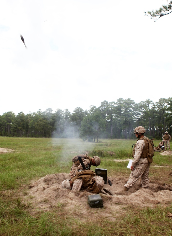 Marines with Charlie Company, 1st Battalion, 2nd Marine Regiment, fire 60 mm rounds out of an M-224 Mortar System on Camp Lejeune, N.C. Aug. 18, 2011. The training served as an opportunity to maintain the unit’s new mortarmen’s skills. The unit is currently scheduled to attach to the 24th Marine Expeditionary Unit.