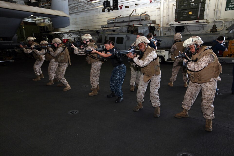 Female Marines and Sailors with the 22nd Marine Expeditionary Unit (MEU) and amphibious assault ship USS Bataan (LHD 5) conduct weapons handling exercises as part of female search team training, Aug. 17-20. The 22nd MEU is currently deployed as part of the Bataan Amphibious Ready Group (BATARG) as the U.S. Central Command theater reserve force, also providing support for maritime security operations and theater security cooperation efforts in the U.S. 5th Fleet area of responsibility.
