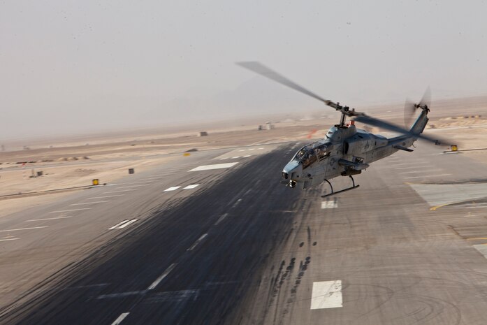 A U.S. Marine Corps AH-1W Super Cobra helicopter with Marine Light Attack Helicopter Squadron 267 takes off from Camp Bastion, Afghanistan, en route to support a close-air support mission, Aug. 19, 2011.