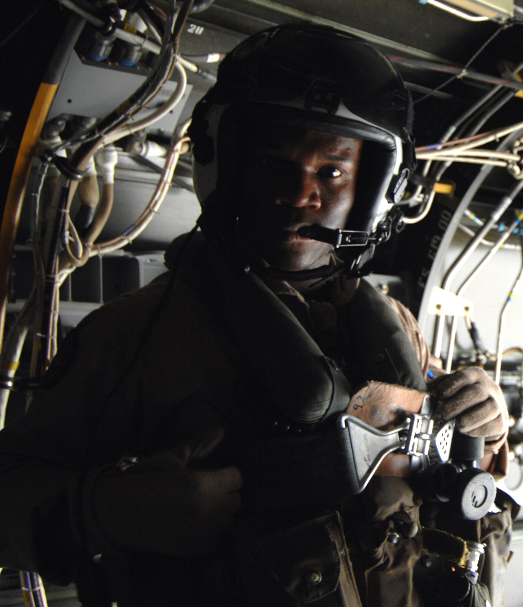 MOUNTAIN HOME AIR FORCE BASE, Idaho – Marine Lance Corporal Richard Campbell, a MV-22 Osprey crew chief stands inside the aircraft here Aug. 18. The Marines took members of the 366th Fighter Wing on “incentive flights” for a few hours during the day. (U.S. Air Force photo by Senior Airman Benjamin Sutton)