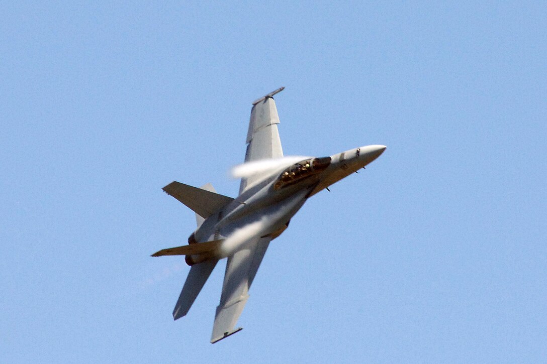 A U.S. Navy F/A-18 Super Hornet makes a high speed pass over Selfridge Air National Guard Base, Mich., Aug. 19, 2011. The Hornet was visiting the base for the Selfridge Air Show and Open House, Aug. 20-21. (USAF photo by John S. Swanson)
