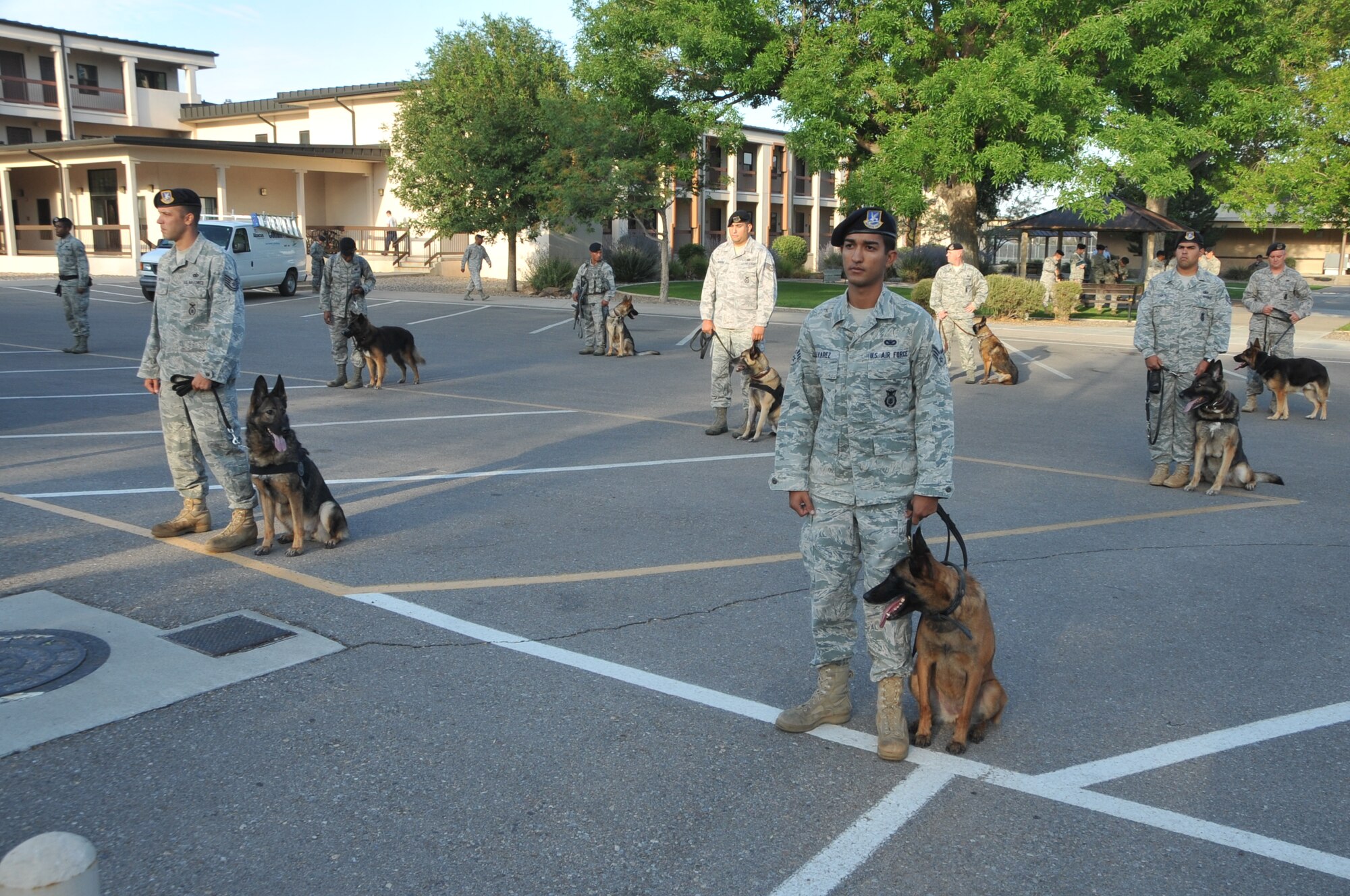 Military working dogs and their handlers with the 377th Security Forces Group take part in the 377 SFG reactivation ceremony Monday. (photo by Todd Berenger)