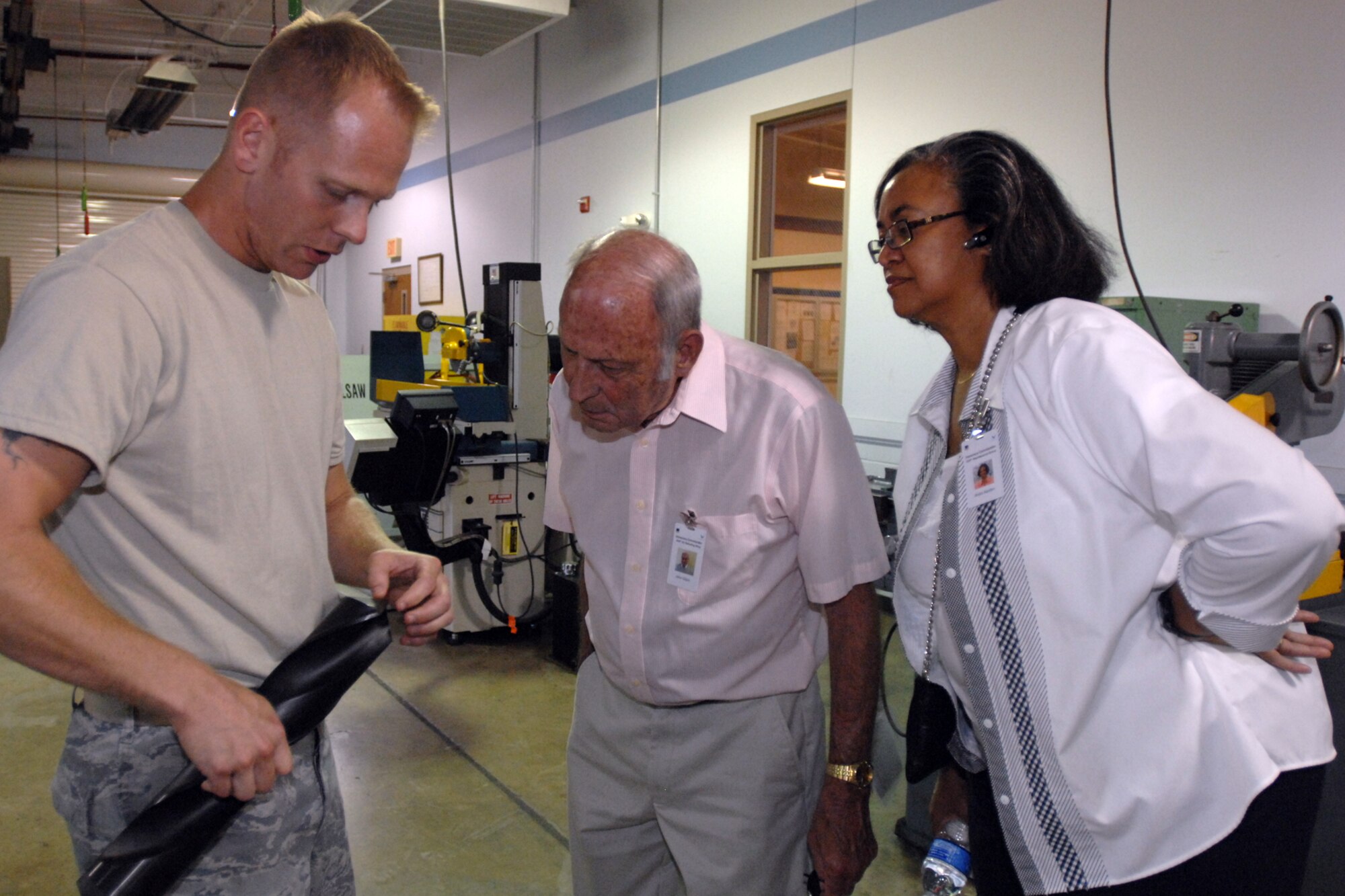 GRISSOM AIR RESERVE BASE, Ind. -- Master Sgt. James Massie, noncommissioned officer in charge of metals technology, shows a giant drill bit to James Gilpin and Anita Harden, both honorary Grissom commanders. Three of the base's honorary commanders visited and toured maintenance areas and backshops to get a better understanding of how the maintainers support the 434th Air Refueling Wing mission. (U.S. Air Force photo/Tech. Sgt. Douglas Hays)