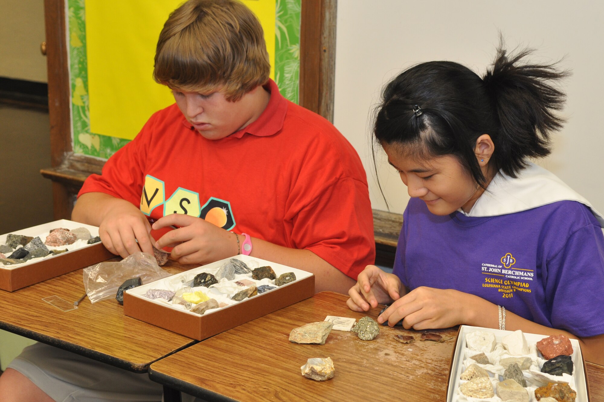 Skylar Ryan and Sophia Silvia, identify rocks and minerals at St. John Berchmans Catholic School in Shreveport, La., Aug. 17, 2011.  The students learned how to identify rocks and minerals by using glass, magnets, iron nails, magnification devices and a streak plate.  Skylar and Sophia are students at St. John Berchmans Catholic School and participated in the STARBASE Louisiana program at Barksdale Air Force Base, La., when they were 5th Graders.  The STARBASE program, which is supported by the 307th Bomb Wing, presents an exciting 25-hour hands on/minds on aviation and aerospace curriculum to area 5th grade students and their teachers. The DoD program is committed to addressing the critical needs in STEM education - Science, Technology, Engineering and Mathematics. STARBASE Louisiana introduces its students to exciting STEM education topics, inspiring these young minds to further explore these topics in future course work. (Courtesy photo by Jeff Walston)