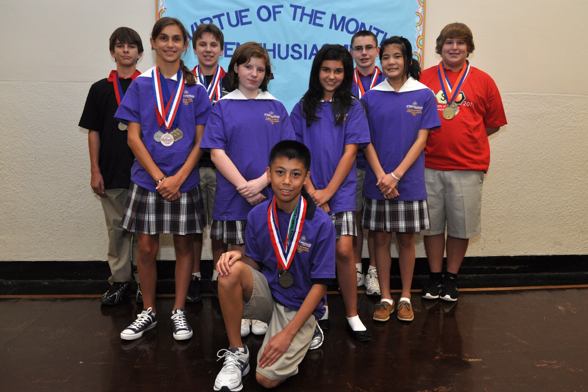 Nick Henderson, Marie Marcalus, Alan Hedrick, Heaven McCallum, A.J. Soriano, Caroline Connell, Matthew Vitacca, Sophia Silvia, and Skylar Ryan, pose for a group photo before the start of the first meeting of the Science Olympiad, Aug. 17, 2011. All nine are students at St. John Berchmans Catholic School in Shreveport, La. When they were 5th Graders, they all participated in the STARBASE Louisiana program at Barksdale Air Force Base, La. The program, which is supported by the 307th Bomb Wing, presents an exciting 25-hour hands on/minds on aviation and aerospace curriculum to area 5th grade students and their teachers. The DoD program is committed to addressing the critical needs in STEM education - Science, Technology, Engineering and Mathematics. STARBASE Louisiana introduces its students to exciting STEM education topics, inspiring these young minds to further explore these topics in future course work. (Courtesy photo by Jeff Walston) 