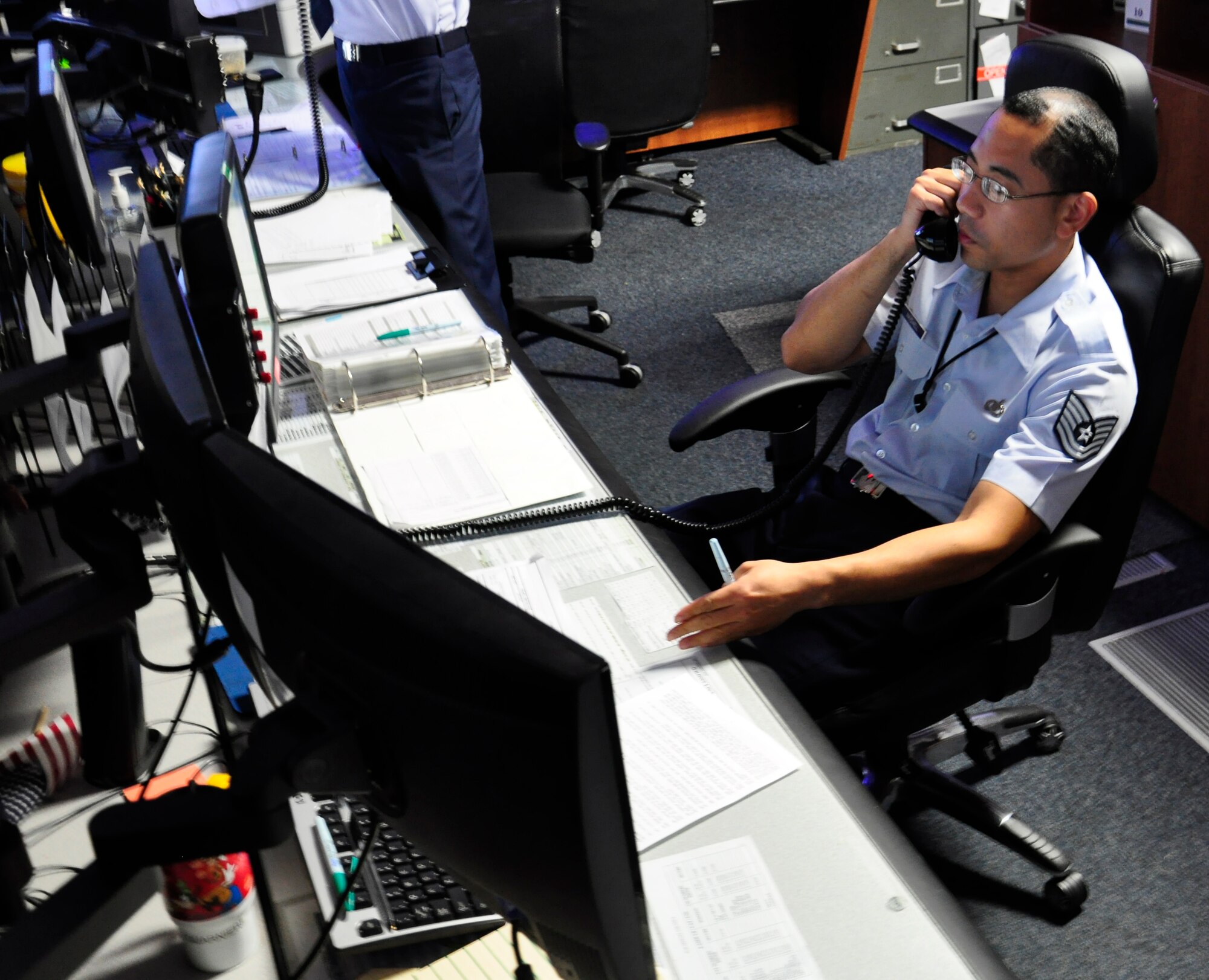 Tech. Sgt. Shingo Maydwell, 6th Air Mobility Wing senior controller, at work on MacDill Air Force Base, Fla., Aug. 15. (US Air Force photo by Airman 1st Class Michael Ellis)