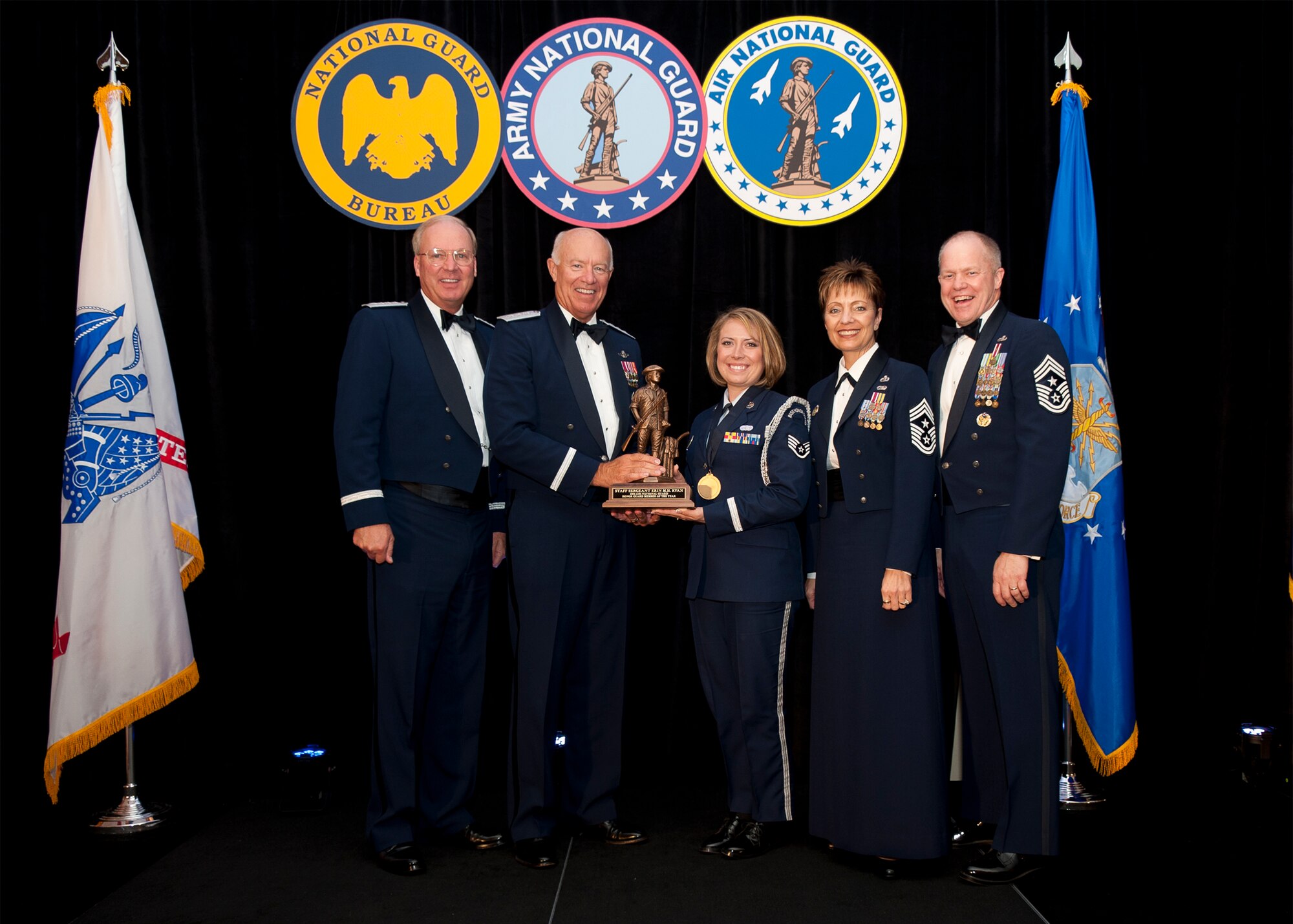 Staff Sergeant Erin M.H. Ryan is a Voucher Examiner assigned to the 101st Air Refueling Wing, Maine Air National Guard, Bangor Maine is named Air National Guard Honor Guard Member of the Year for 2011. The award was presented at the Outstanding Soldiers and Airmen of the Year banquet in Arlington Virginia. Presenting the award are (left to right) General Craig R. McKinley, Chief, National Guard Bureau, Leiutenant General Harry M. Wyatt III, Director Air National Guard, Chief Master Sergeant Denise M. Jelinski-Hall, Senior Enlisted Leader for the National Guard Bureau, and Chief Master Sergeant Christopher E. Muncy, Command Chief Master of the National Guard. (USAF Photo by MSgt Marvin R. Preston, 169th FW/PA) 