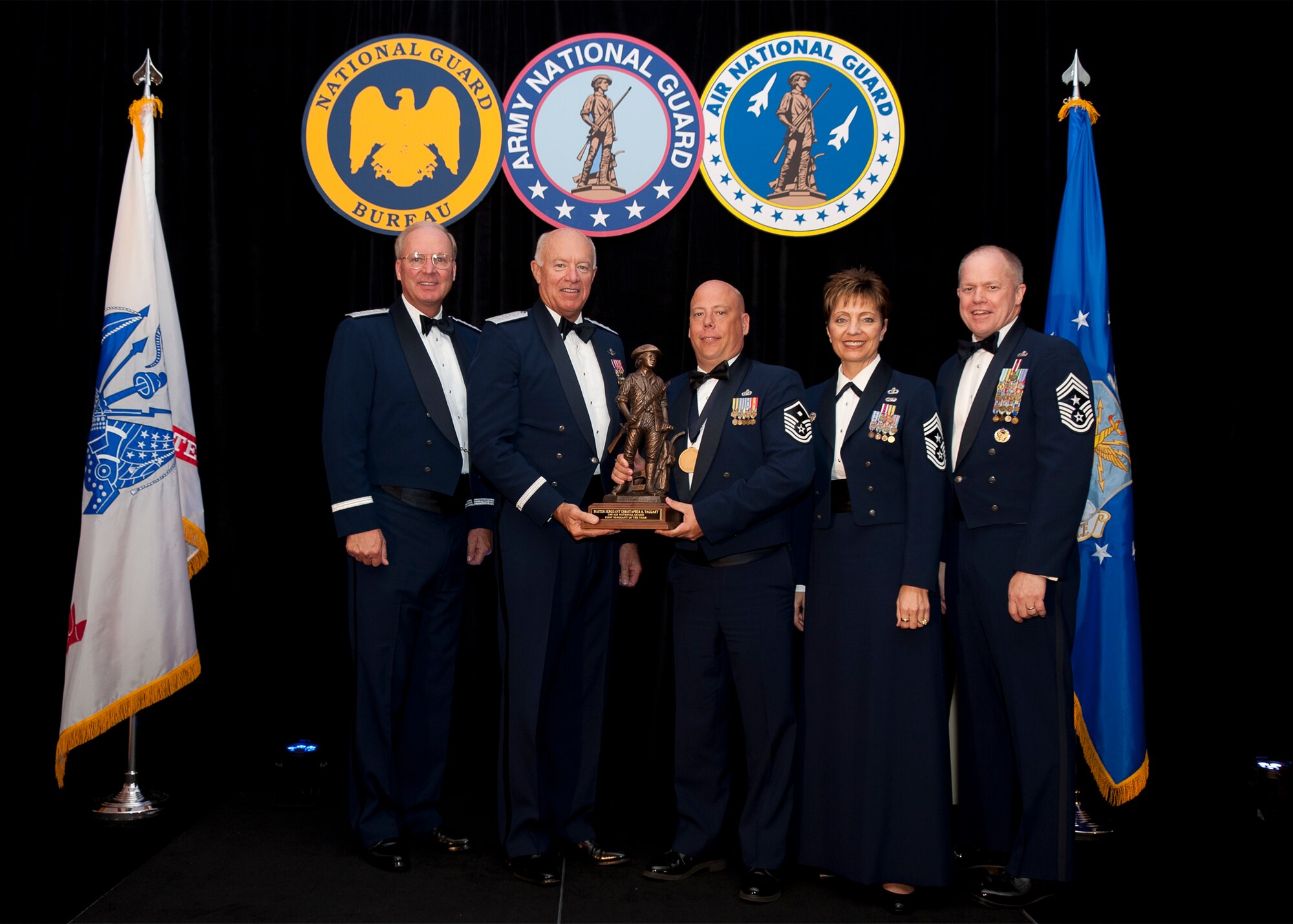 Master Sergeant Christopher R. Taggart, a First Sergeant assigned to the 177th Security Forces Squadron, New Jersey Air National Guard is named Air National Guard First Sergeat of the Year for 2011. The award was presented at the Outstanding Soldiers and Airmen of the Year banquet in Arlington Virginia. Presenting the award are (left to right) General Craig R. McKinley, Chief, National Guard Bureau, Leiutenant General Harry M. Wyatt III, Director Air National Guard, Chief Master Sergeant Denise M. Jelinski-Hall, Senior Enlisted Leader for the National Guard Bureau, and Chief Master Sergeant Christopher E. Muncy, Command Chief Master of the National Guard. (USAF Photo by MSgt Marvin R. Preston, 169th FW/PA) 