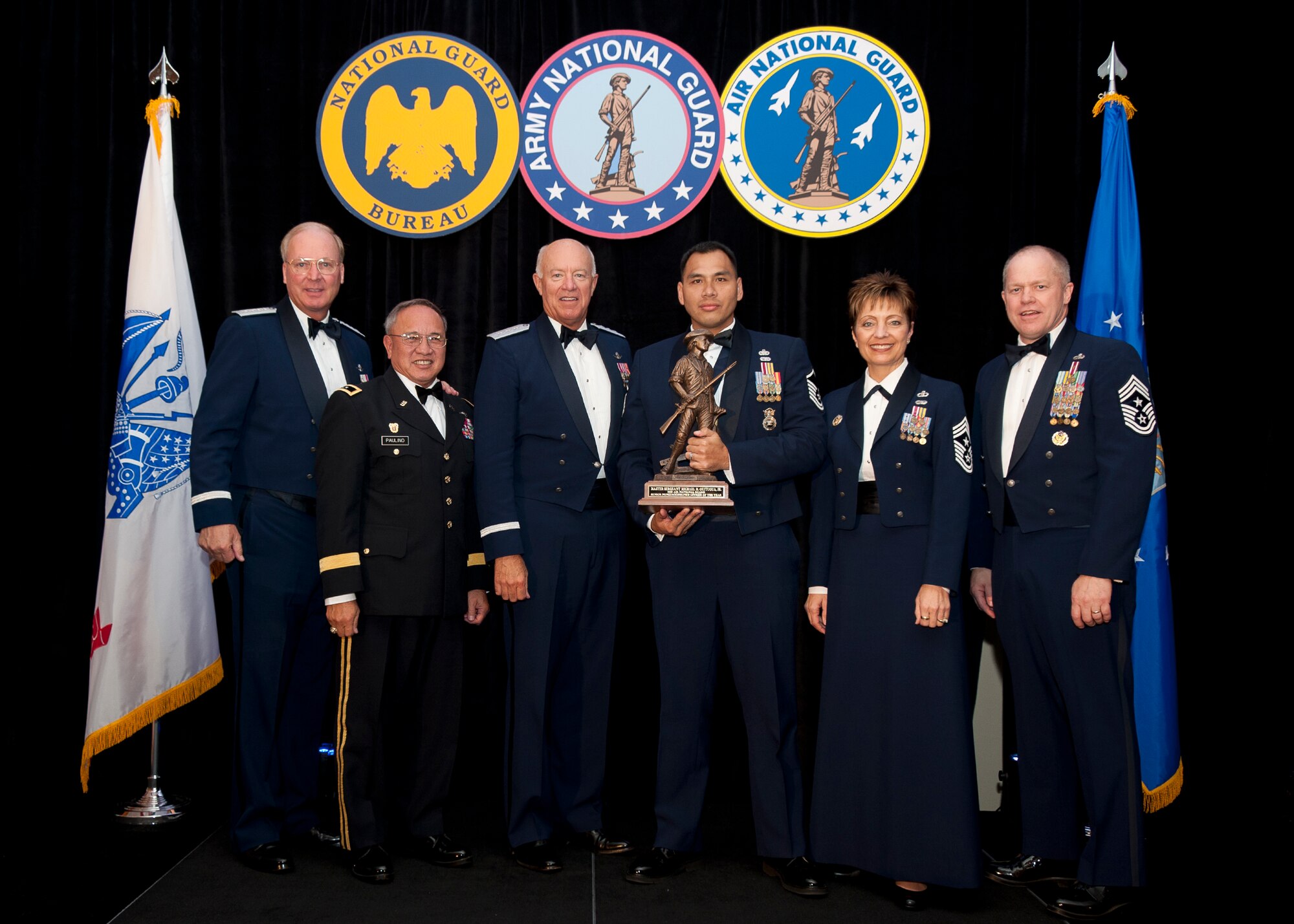 Master Sergeant Michael M. Quitugua, assigned to the 245th Security Forces Squadron, Guam Air National Guard is named Air National Guard Senior Non-Comossioned Officer of the Year for 2011. The award was presented at the Outstanding Soldiers and Airmen of the Year banquet in Arlington Virginia. Presenting the award are (left to right) General Craig R. McKinley, Chief, National Guard Bureau, Major General Benny Meno Paulino, The Adjutant General of Guam, Lieutenant General Harry M. Wyatt III, Director Air National Guard, Chief Master Sergeant Denise M. Jelinski-Hall, Senior Enlisted Leader for the National Guard Bureau, and Chief Master Sergeant Christopher E. Muncy, Command Chief Master of the National Guard. (USAF Photo by MSgt Marvin R. Preston, 169th FW/PA) 