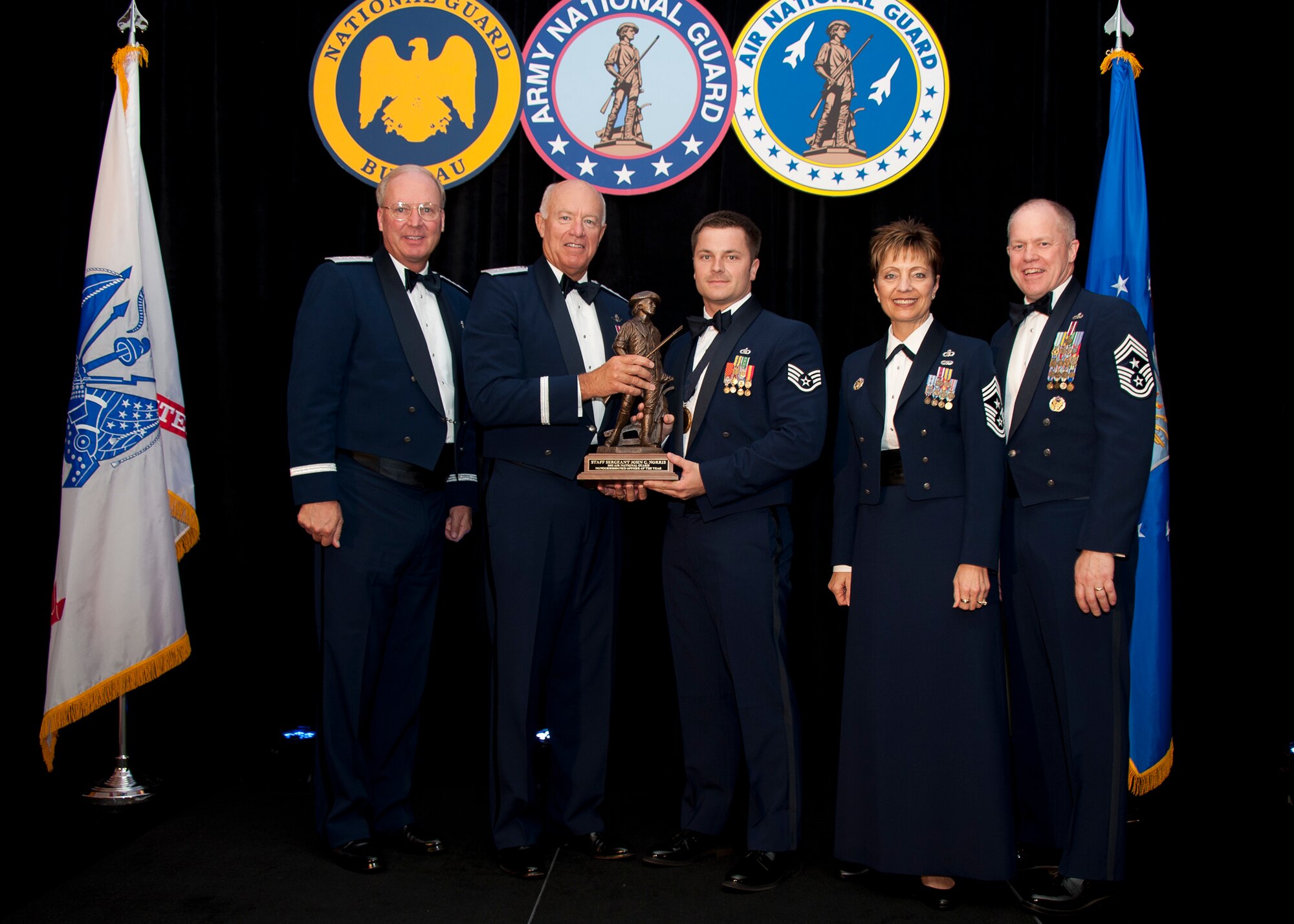 Staff Sergeant John C. Norris, a Tactical Air Control Party member assigned to the 148th Air Support Operations Squadron, Fort Indiantown Gap, Pennsylvania, is named Air National Guard Non-Comissioned Officer of the Year for 2011. The award was presented at the Outstanding Soldiers and Airmen of the Year banquet in Arlington Virginia. Presenting the award are (left to right) General Craig R. McKinley, Chief, National Guard Bureau, Leiutenant General Harry M. Wyatt III, Director Air National Guard, Chief Master Sergeant Denise M. Jelinski-Hall, Senior Enlisted Leader for the National Guard Bureau, and Chief Master Sergeant Christopher E. Muncy, Command Chief Master of the National Guard. (USAF Photo by MSgt Marvin R. Preston, 169th FW/PA) 