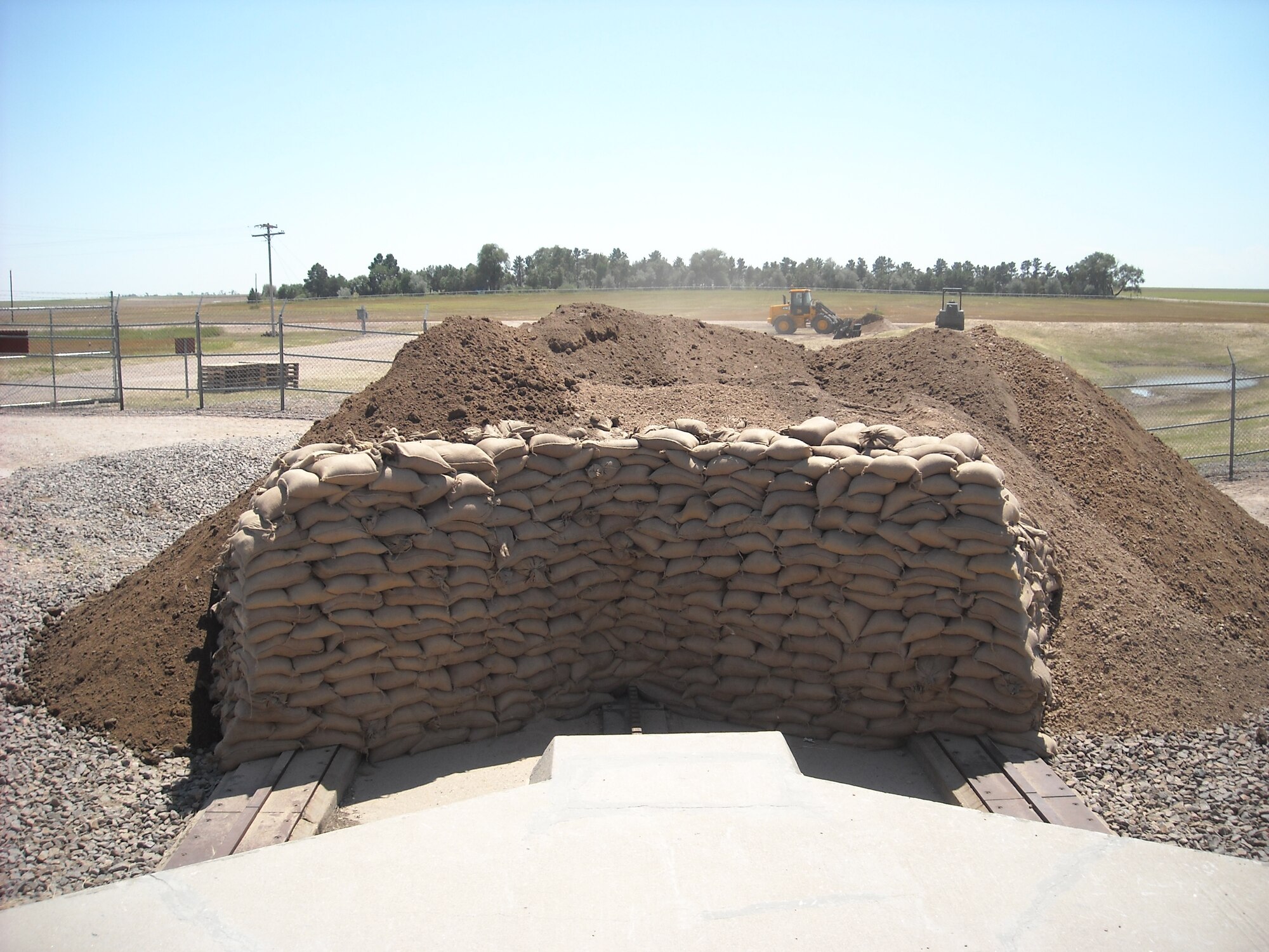 A photo of the sand barrier at Launch Facility Hotel-08 constructed by wing volunteers. The effort was headed up by 2nd Lt. James Tyhurst, 90th Civil Engineer Squadron. The barrier will aid in stopping the launcher closure door after it is blown open. (U.S. Air Force Photo by 2nd Lt. James Tyhurst)