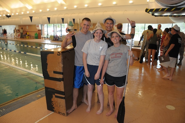 The 90th Force Support Squadron won the Build-a-Boat competition of Xtreme Challenge Aug. 12. The winning shipmates were Senior Airman Jackie Freeman, ship’s skipper; Senior Airman Christy Stigen, ship captain; Senior Airman Preston Elliott, assistant; and Staff Sgt. John Shirley.  Their boat was named “The Triple Threat,” which represents the communication, contracting and force support squadrons. (U.S. Air Force photo by Blaze Lipowski)