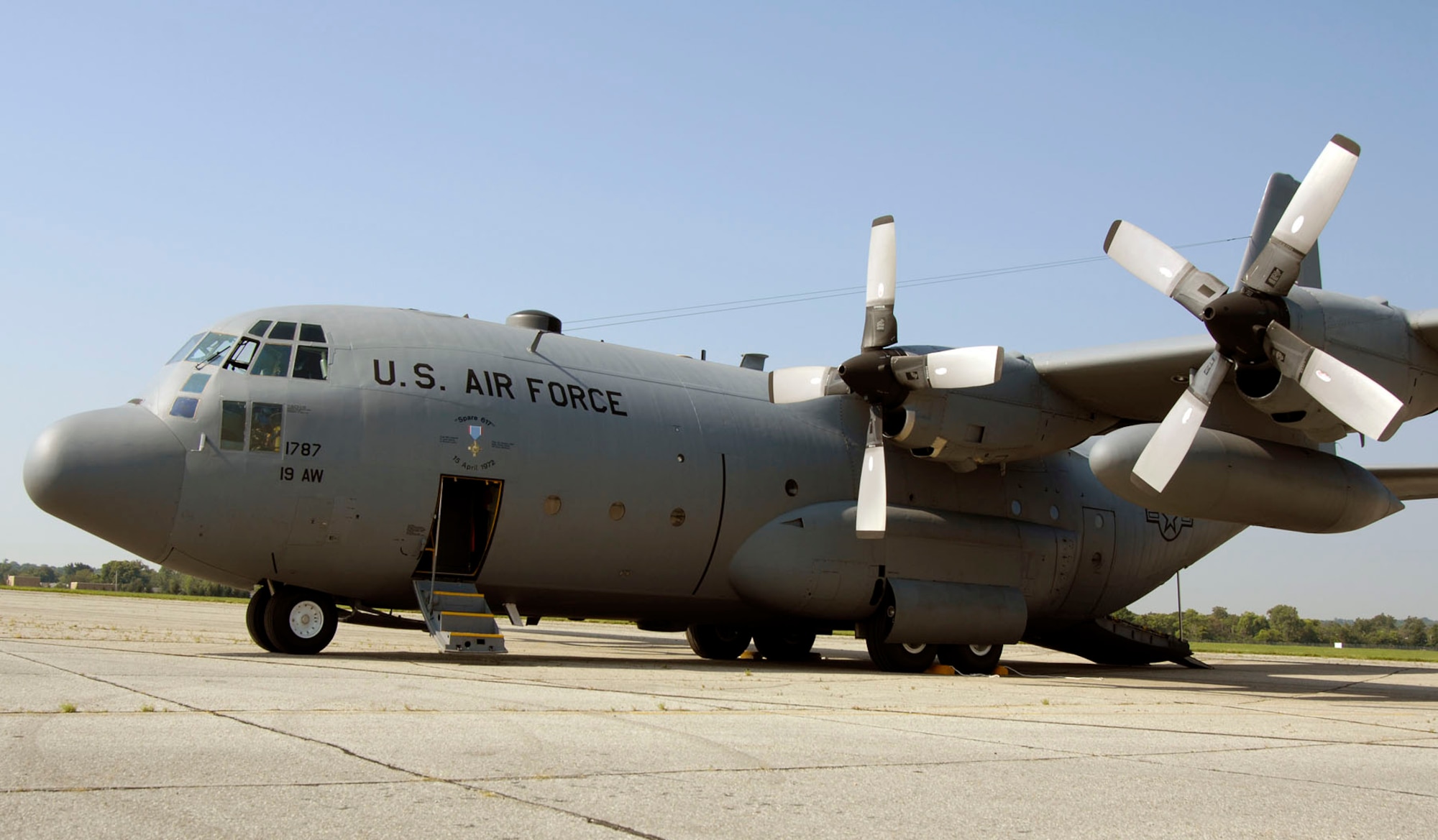 DAYTON, Ohio -- The C-130E SPARE 617 arrives at the National Museum of the U.S. Air Force after its final flight on Aug. 18, 2011. Not only is this C-130E (S/N 62-1787) representative of all C-130 transport aircraft, it also performed courageous work during the Southeast Asia War. Two members of its crew – Capt. William Caldwell, pilot, and Tech. Sgt. Charlie Shaub, loadmaster – were awarded Air Force Crosses, the U.S. Air Force’s second highest award for valor, for their heroic actions during the siege of An Loc in 1972. (U.S. Air Force photo by Michelle Gigante)