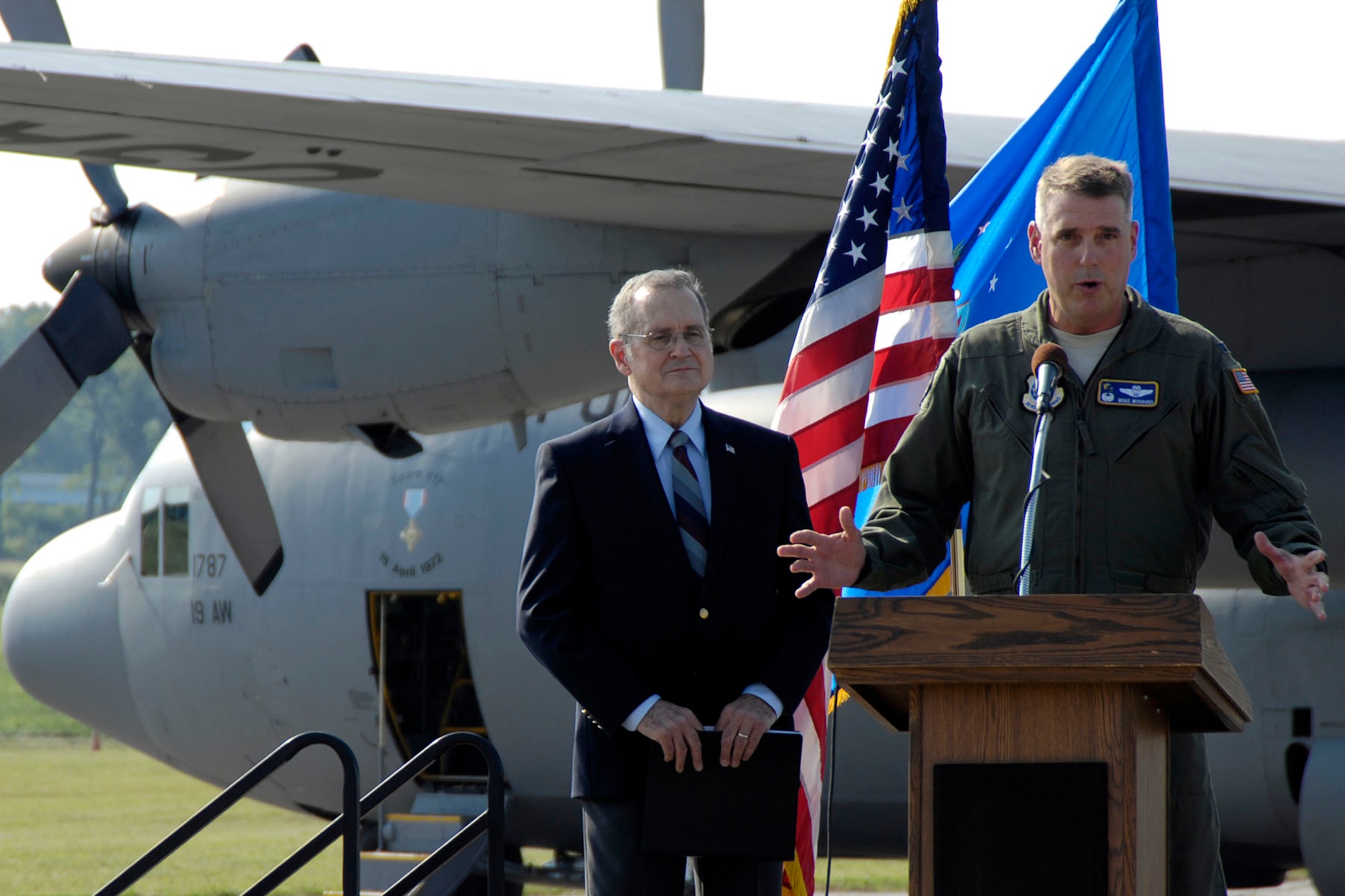 DAYTON, Ohio -- Col. Michael A. Minihan, commander of the 19th Airlift Wing, addresses the audience after the C-130E made its final flight on Aug. 18, 2011. Col. Minihan piloted the aircraft on its final flight. (U.S. Air Force photo by Michelle Gigante)