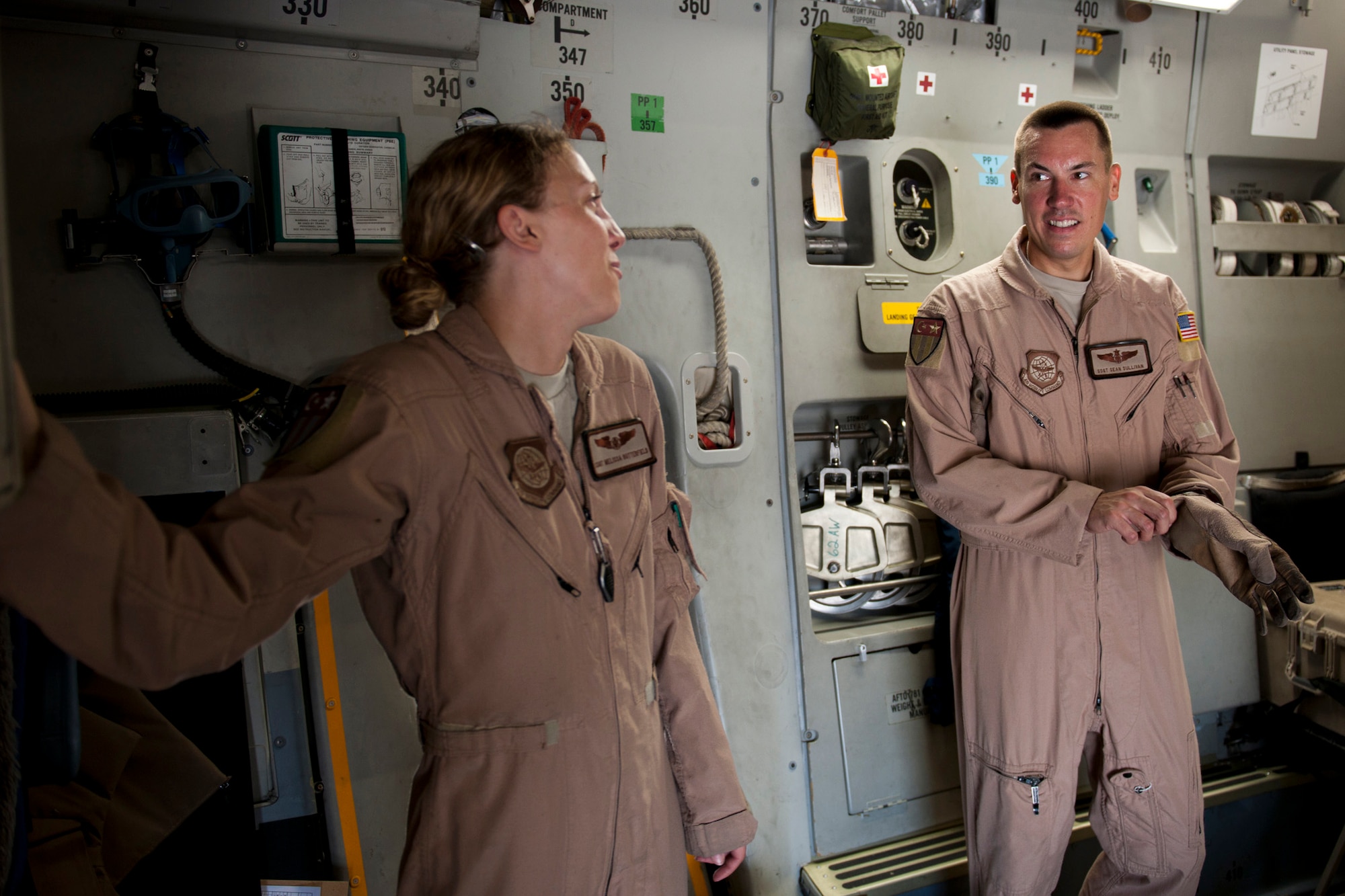Staff Sgts. Melissa Butterfield, left, and Sean Sullivan, 817th Expeditionary Airlift Squadron loadmasters, share a laugh onboard a C-17 Globemaster III aircraft Aug. 18, 2011, at Incirlik Air Base, Turkey, prior to a mission to transport equipment and supplies to Kandahar Air Field, Afghanistan. Loadmasters are responsible for ensuring cargo is properly loaded and secured. (U.S. Air Force photo by Tech. Sgt. Michael B. Keller/Released)