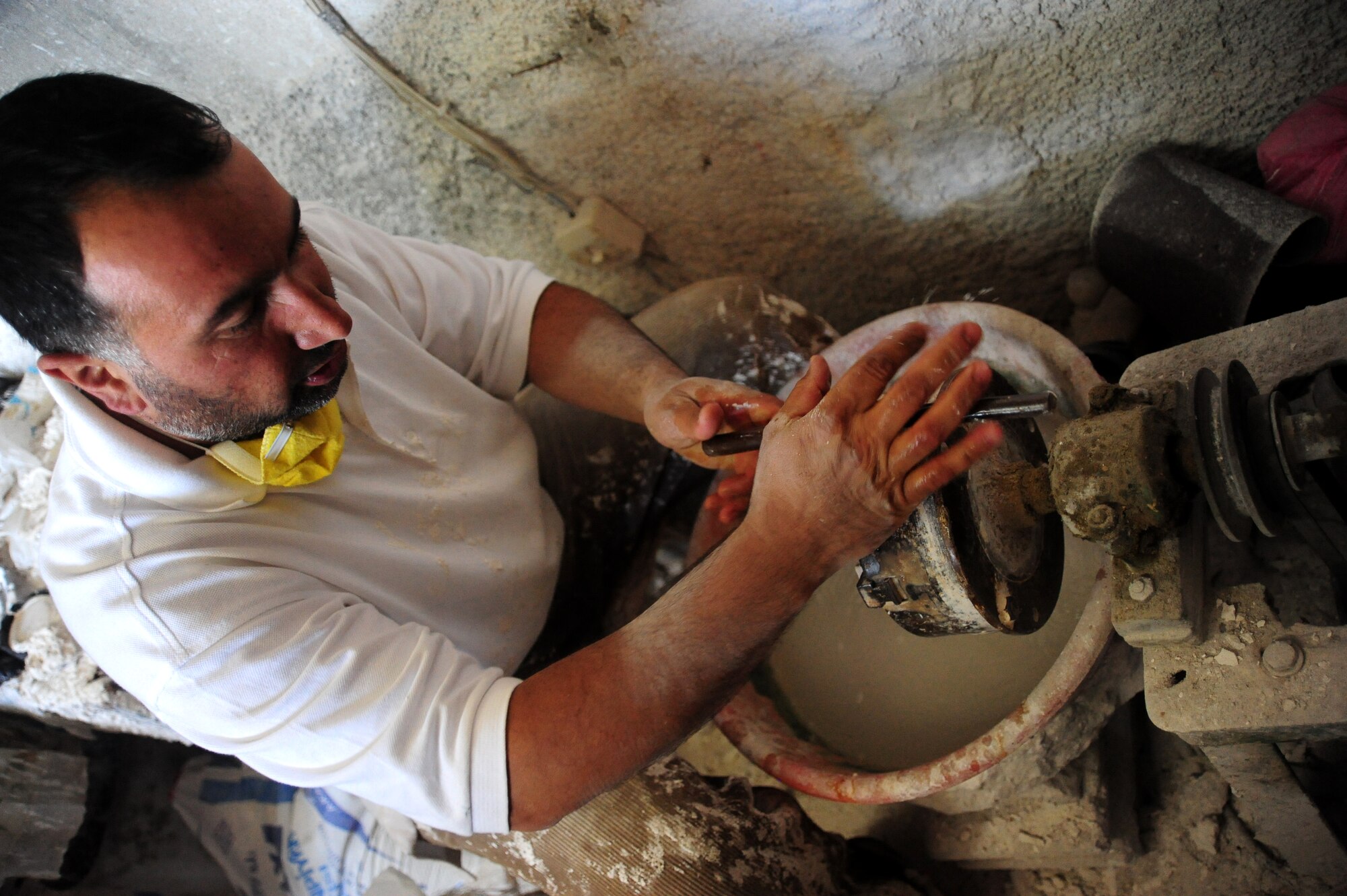 A local Turkish sculptor polishes an onyx egg for Airmen and their families as part of a base tour Aug. 13, 2011, at Cappadocia, Turkey.  The tour lasted two days, visiting a multitude of local venders, historical locations and museums. (U.S. Air Force photo by Senior Airman Anthony Sanchelli/Released) 
