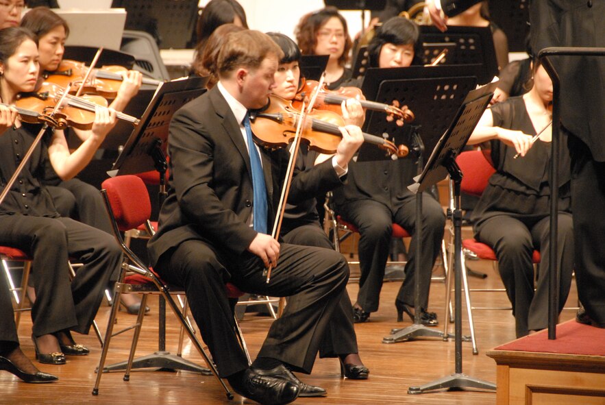 KUNSAN AIR BASE, Republic of Korea -- Lead violinists perform at the Gunsan City Orchestra here Aug. 18. Free tickets were provided to active duty Airmen and their families. (U.S. Air Force photo/1st Lt. Trisha Eldredge)