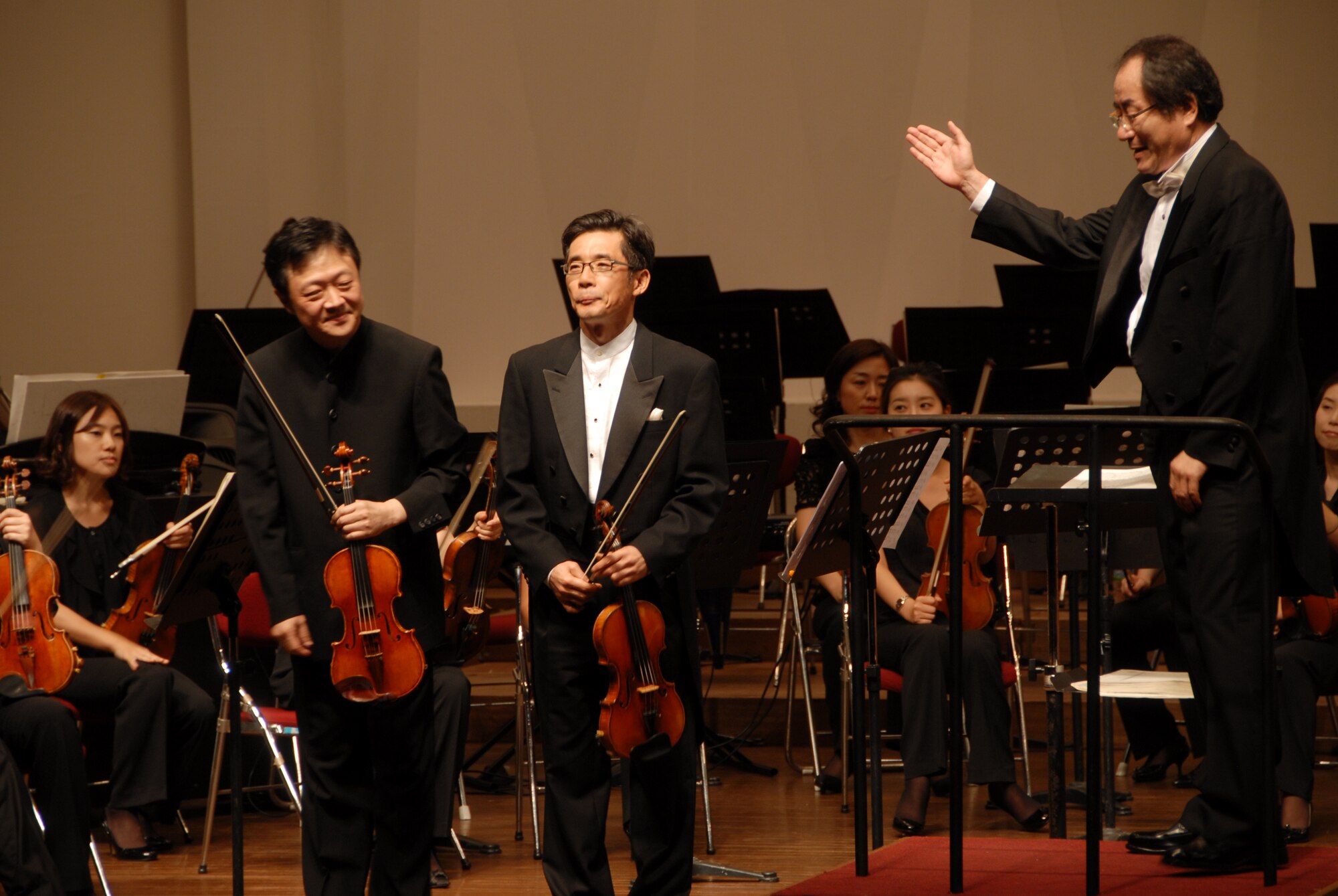 KUNSAN AIR BASE, Republic of Korea -- The Gunsan City Orchestra performance highlighted violinists Kim Gwang-Gun and Song Jae-Gwang, led by conductor Jung Nak-Bok.  Free tickets were provided to active duty Airmen and their families. (U.S. Air Force photo/1st Lt. Trisha Eldredge)