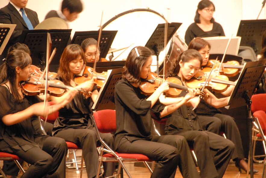 KUNSAN AIR BASE, Republic of Korea -- Members of the Gunsan City Orchestra perform during the Summer Classic Concert here Aug. 18. Free tickets were provided to active duty Airmen and their families. (U.S. Air Force photo/1st Lt. Trisha Eldredge)
