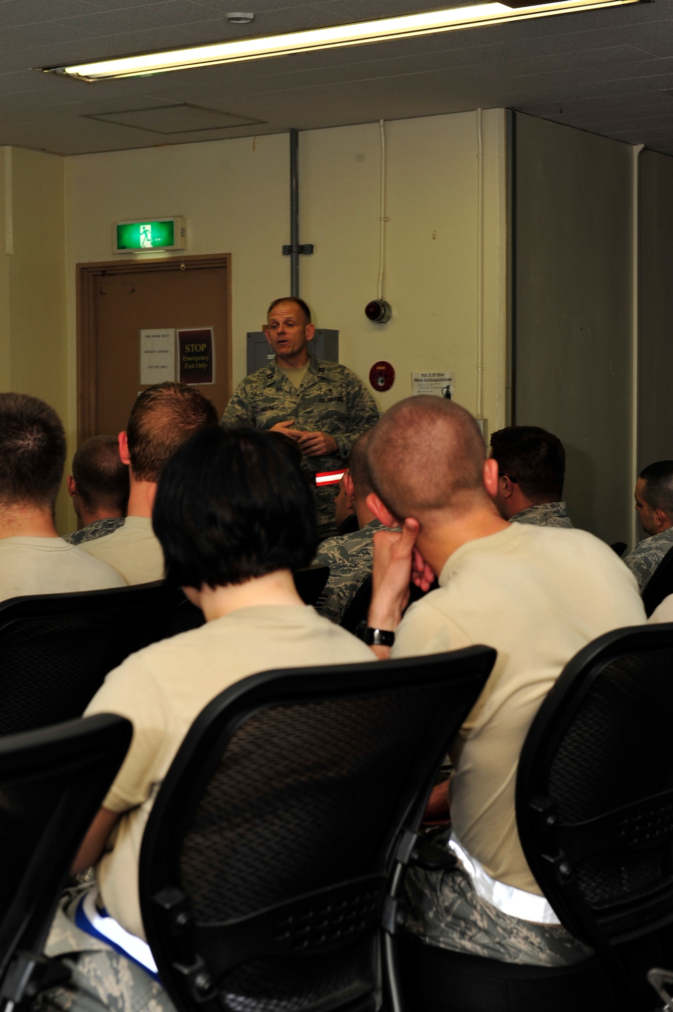 Capt Dave Kruse (center), a Catholic chaplain with the 18th Wing Chaplains gives members of the 18th Security Forces Squadron a pre-deployment brief during a no-notice Operational Readiness Inspection at Kadena Air Base, Japan, Aug 19.  Team Kadena conducted several local operational readiness exercises in preparation for this inspection. (U.S. Air Force photo/Staff Sgt. Lakisha A. Croley)
