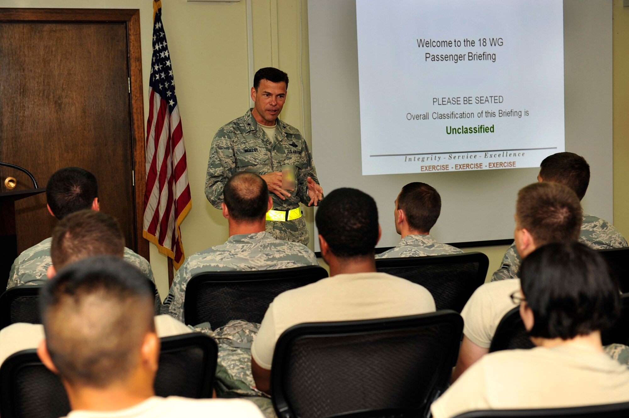 Brig. Gen. Matt Molloy (center), 18th Wing commander gives a brief statement before he and members of the 18th Security Forces Squadron receive their pre-deployment briefs during a no-notice operational readiness inspection at Kadena Air Base, Japan, Aug. 19. Team Kadena was graded on combat capability and over all operational preparedness. (U.S. Air Force photo/Staff Sgt. Lakisha A. Croley)