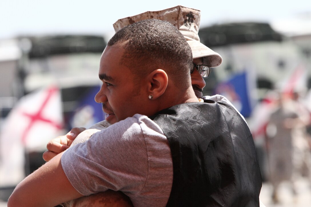 Charles E. Vinson Jr. (right), from Oceanside, Calif., hugs his father, Master Gunnery Sgt. Charles E. Vinson, chief supply administration, G-4, Headquarters Company, Combat Logistics Regiment 17, 1st Marine Logistics Group, during his father’s retirement ceremony on Camp Pendleton, Calif., Aug. 19. Vinson, from Montgomery, Al., retired after serving 30 years of faithful service to the Marine Corps.
