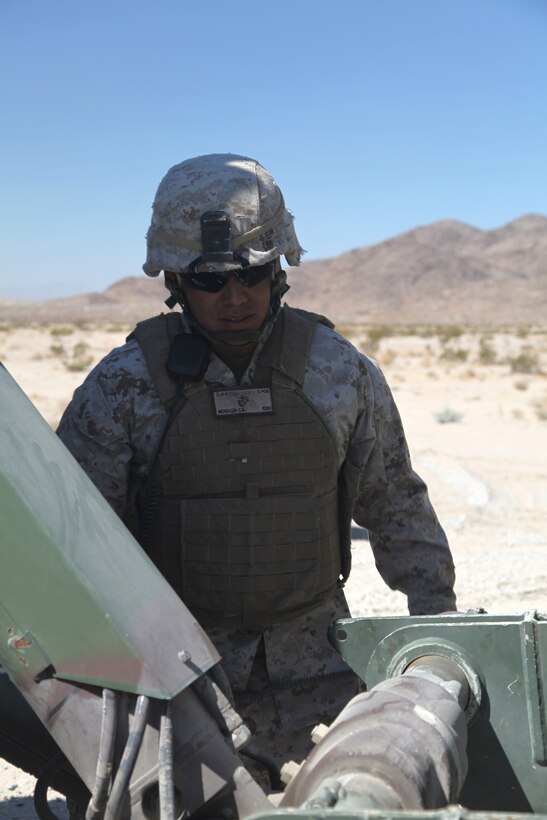 Lance Cpl. Cruz A. Mendoza, a motor transport operator with Material Readiness Company, Combat Logistics Battalion 7, 1st Marine Logistics Group, provides maintenance on a downed vehicle during a training convoy at Marine Corps Air Ground Combat Center Twentynine Palms, Calif., Aug. 19.