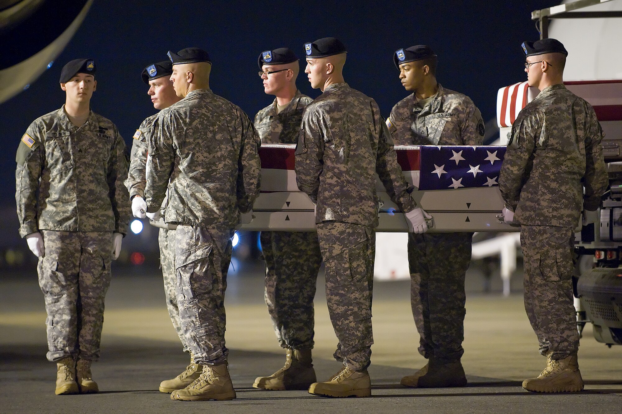 A U.S. Army carry team transfers the remains of Army Pfc. Douglas L. Cordo, of Kingston, N.Y., at Dover Air Force Base, Del., Aug. 20, 2011. Cordo was assigned to the 1st Battalion, 24th Infantry Regiment, 1st Brigade Combat Team, 25th Infantry Division, Fort Wainwright, Alaska. (U.S. Air Force photo/Steve Kotecki)