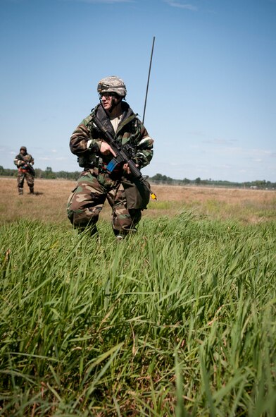 VOLK FIELD, Wis. -- The 459th Air Refueling Wing participated in a field training exercise here Aug. 15-21. The exercise was the final part of a four-step Operational Readiness Training Plan designed to help organizations like the 459th ARW be more successful in real-world rapid deployment scenarios and Operational Readiness Inspections. Throughout the week Airmen were trained by Volk Field cadre in different areas like self aid and buddy care, weapons familiarization and surviving chemical threats. All of the training culminated with a simulated wartime scenario, putting learned skills to the test against an opposing force at a forward operating base. (U.S. Air Force photo/Tech. Sgt. Steve Lewis)