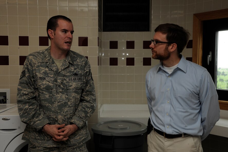 KUNSAN AIR BASE, Republic of Korea -- Staff Sgt. Andrew Meek, 8th Civil Engineer Squadron building 535 dorm manager, talks about the living conditions of the new dorm to Dr. Jamie M. Morin, Assistant Secretary of the Air Force for Financial Management and Comptroller, here Aug. 18. As part of a Pacific Air Forces tour, Morin visited Kunsan and spoke with many Wolf Pack members. (U.S. Air Force photo/Staff Sgt. Rasheen Douglas)