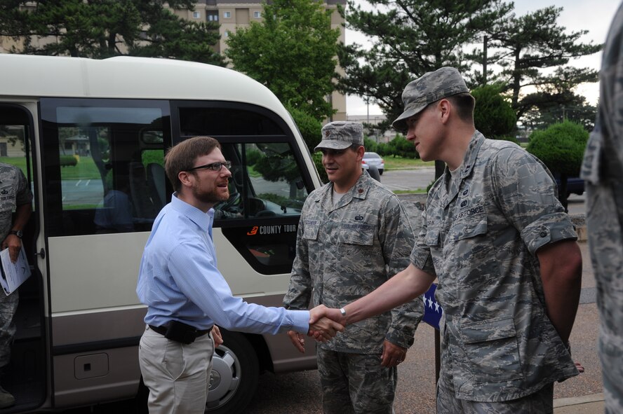 KUNSAN AIR BASE, Republic of Korea -- Dr. Jamie M. Morin, Assistant Secretary of the Air Force for Financial Management and Comptroller, is greeted by members of the 8th Force Support Squadron outside the dining facility here Aug. 18. As part of a Pacific Air Forces tour, Morin visited Kunsan and spoke with many Wolf Pack members. (U.S. Air Force photo/Staff Sgt. Rasheen Douglas)