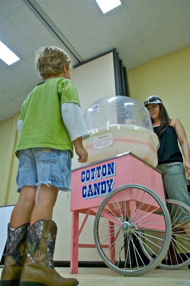 LAUGHLIN AIR FORCE BASE, Texas -- A boy waits for his cotton candy at the Fair by the Chapel here Aug. 21. The fair was open to the Laughlin community and offered food and games for all ages. (U.S. Air Force photo/Senior Airman Scott Saldukas)