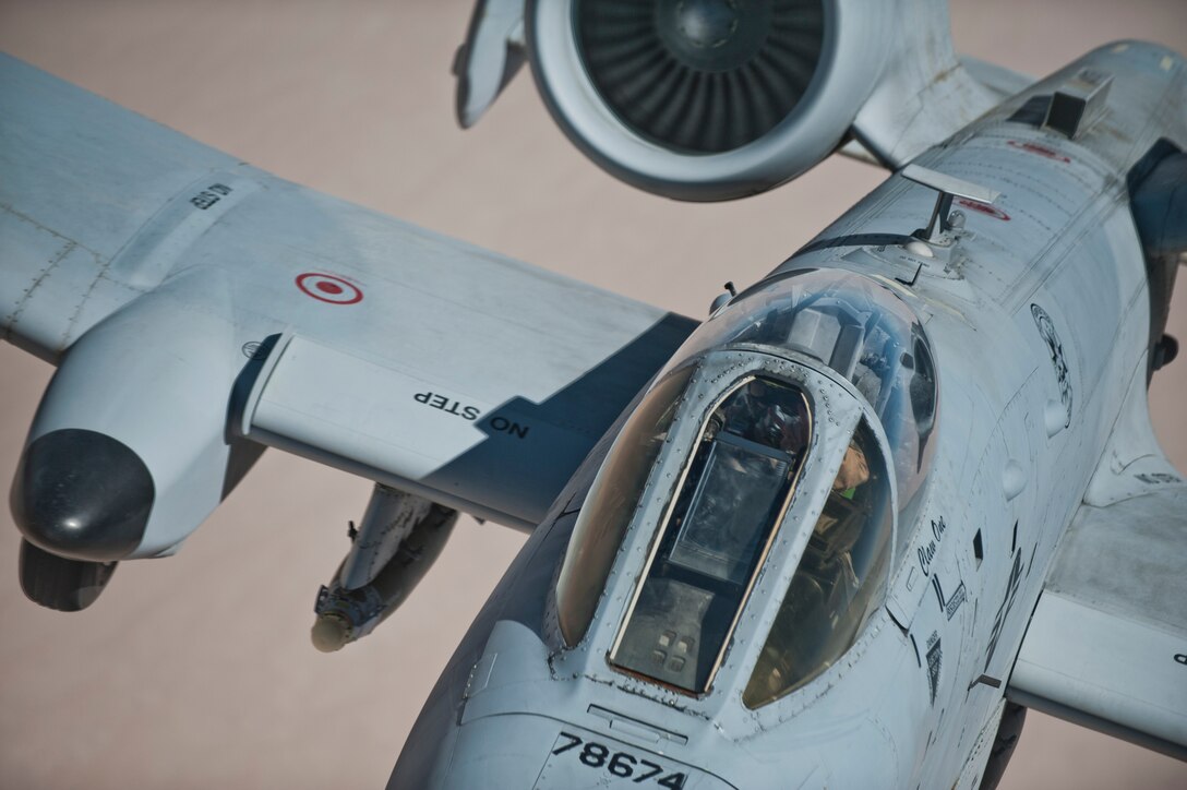 An A-10 Thunderbolt II moves into position behind a KC-135 Stratotanker before refueling. The A-10, deployed to Afghanistan from 23rd Wing at Moody AFB, GA, is on a mission providing close air support to coalition forces in Afghanistan. (U.S. Air Force Photo/Master Sgt. Jeffrey Allen)
