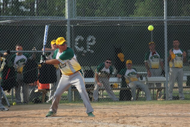 Master Gunnery Sgt. Kevin D. Basso steps into a swing during the 2011 East Coast Regional Softball Tournament hosted by MCAS Cherry Point, Aug. 22.