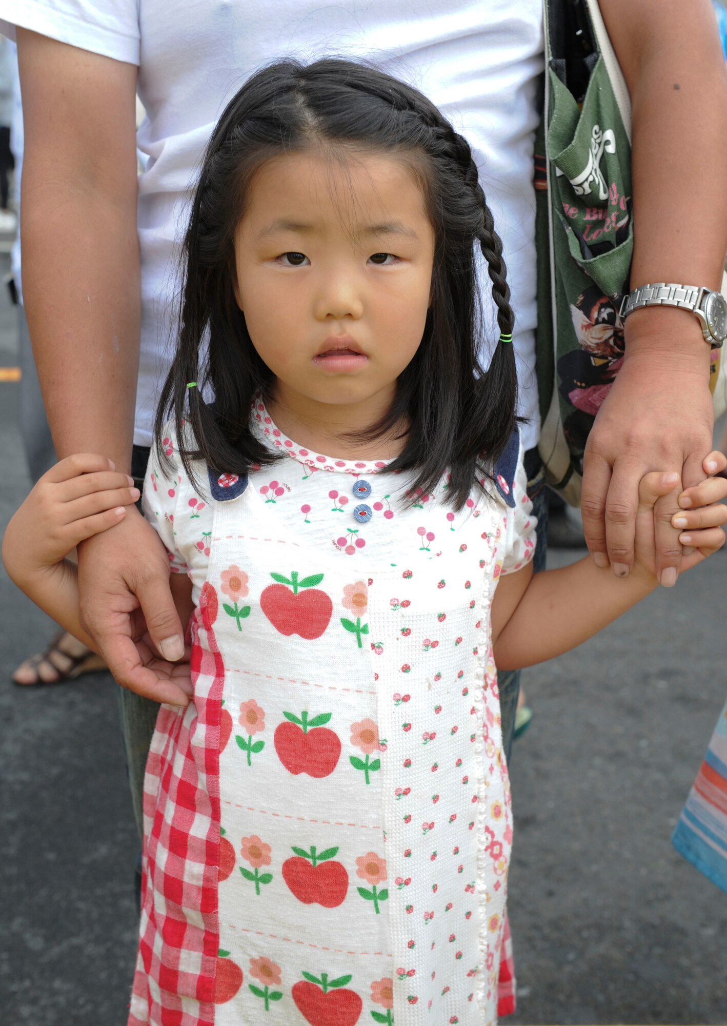 YOKOTA AIR BASE, Japan -- Natsumi Yamaguchi, a guest at the 2011 Yokota Air Base Japanese-American Friendship Festival, poses for a photo Aug 21, 2011. Natsumi's favorite part about the festival was the airplanes. This year's festival drew a crowd of approximately 117,000 visitors, offering a variety of live music, merchandise booths and American and Japanese food for everyone to enjoy. (U.S. Air Force photo / Staff Sgt. Stacy Moless) 
